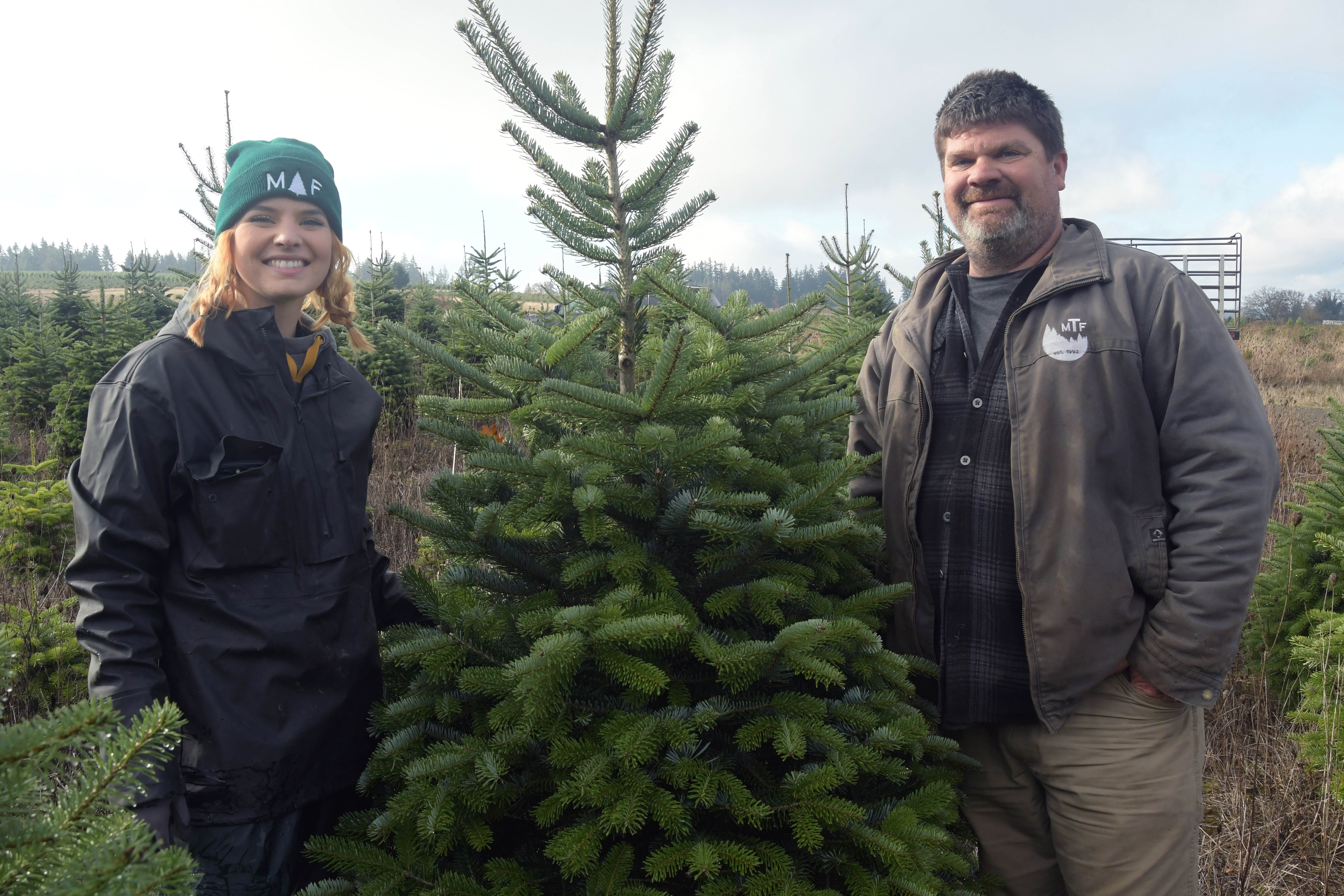 Brooklynn and Greg Smith in a Christmas tree field.