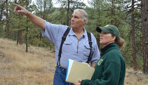 Oregon Department of Forestry consulting with a landowner