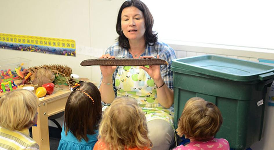Teacher and students in a classroom. 