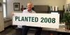 Paul Barnum holds a planted sign